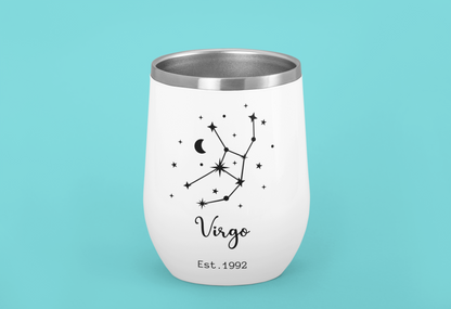 White tumbler with Virgo zodiac design on a teal background